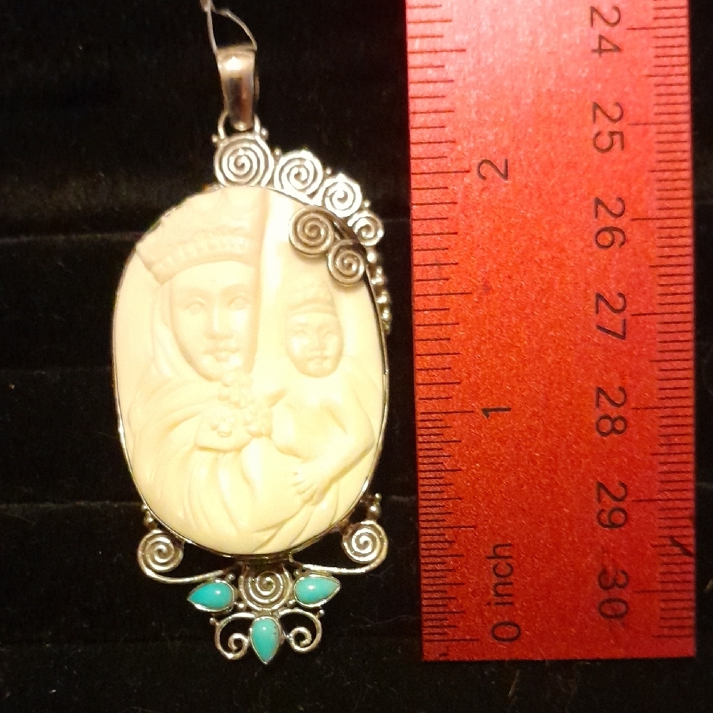 Elegant Silver and Cream Cameo Pendant